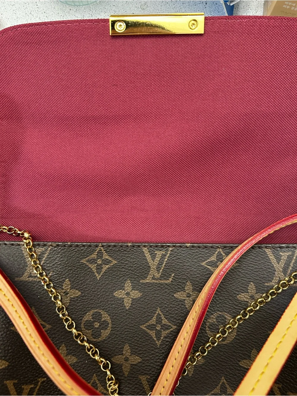 Louis Vuitton Monogram Canvas Clutch in Brown with Gold Accent